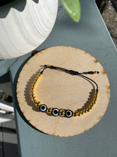 Load image into Gallery viewer, Black and gold beaded bracelet
